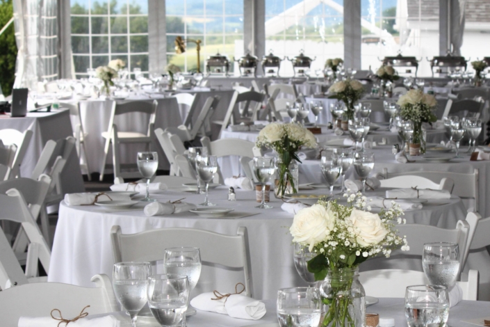 Banquet room with outdoor view set for a beautiful wedding